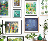 Red Gate Arts framed print gallery wall featuring Cat at night, Goodnestone Lemons, Cat and Pond, Whale, Tropical Moon, Koala, and Common Houseplants art print designs 